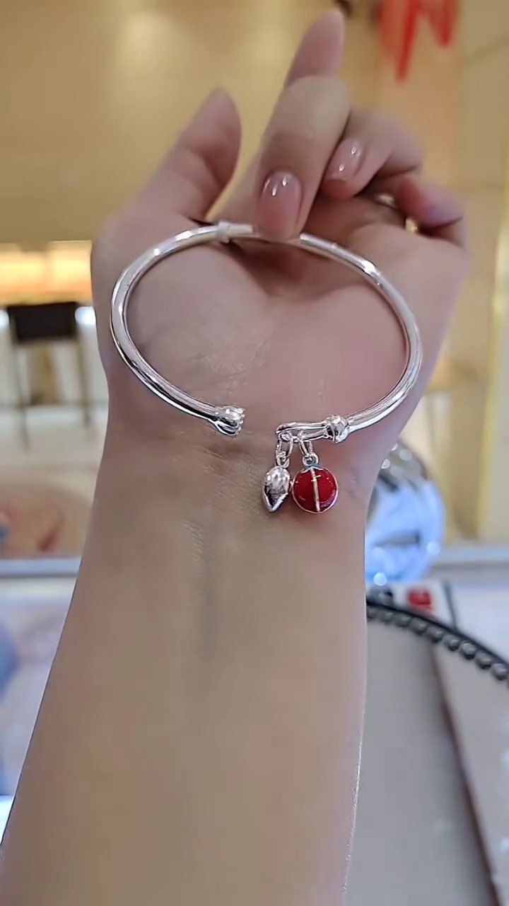 Charming Silver-Toned Bangle Bracelet with Enamel Ladybug and Leaf Charms - Image 2