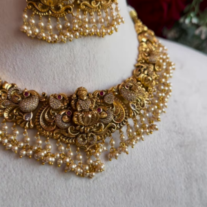 Ornate Gold-Plated Temple Jewellery Necklace Set with Goddess Lakshmi and Pearl Drops