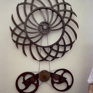 Intricate Kinetic Wall Sculpture with Moving Gears and Abstract Design